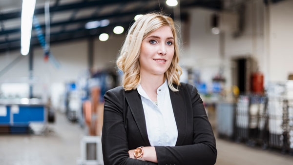 Young confident woman in work environment